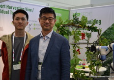 Ruiyuan Wang and Xing Fang next to the K2 harvesting robot.